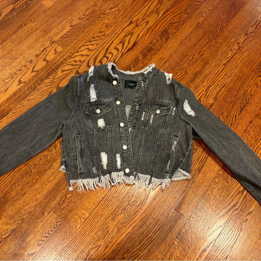 Women’s size medium black distressed jean jacket